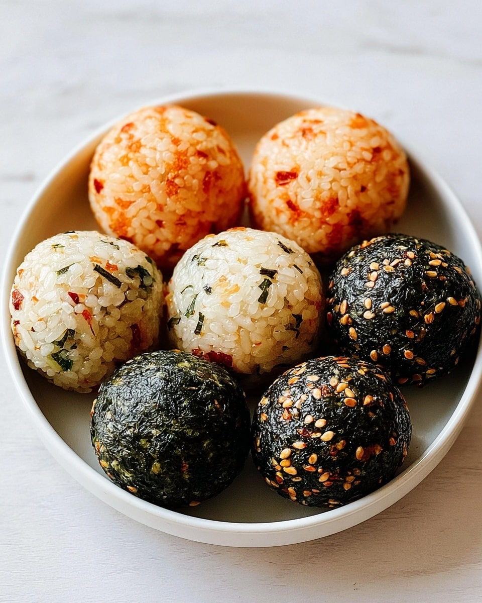 Seven round rice balls sit closely together in a white bowl, each about the same size and perfectly shaped. Three balls have a light orange color with small red specks, two balls are mixed white rice with green and orange bits, and two balls are dark green/black covered in sesame seeds and other small spices. The rice grains are visible in all balls, giving a textured look. The bowl rests on a white marbled texture, creating a clean and simple background. photo taken with an iphone --ar 4:5 --v 7
