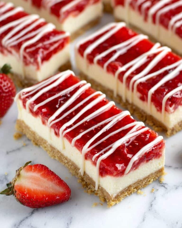 Philadelphia Cheesecake Bars with Strawberry Sauce and White Chocolate Drizzle Recipe